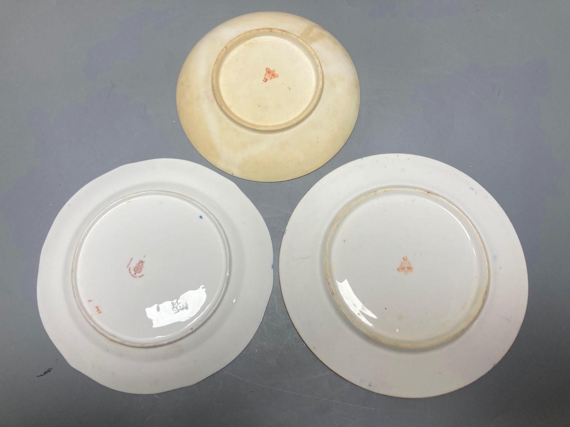 Two Royal Crown Derby Imari pattern plates, three Crown Derby plates or saucers, a Royal Crown Derby cup and two saucers and two Red Av